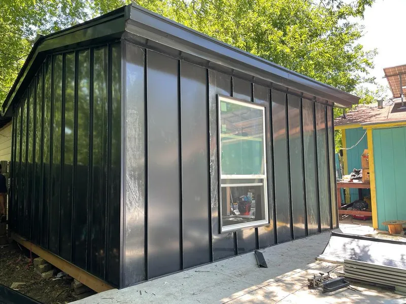 Black standing seam metal wall panels for Roof Inspection in Leonia